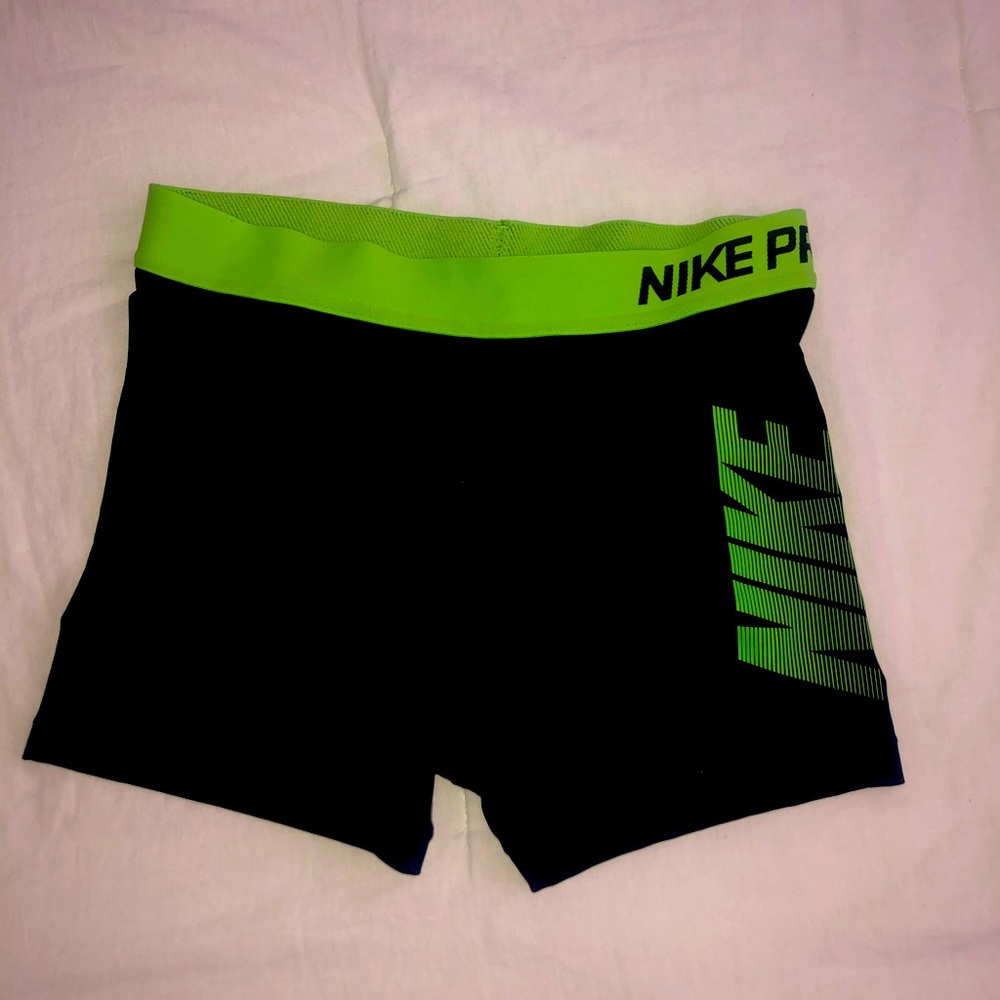 Green and black Nike spandex